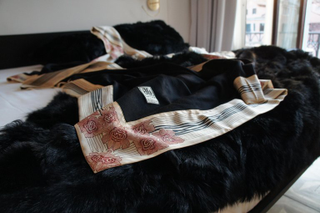 Illustration for article titled Behold Beauty in a Black. Now Voyager Luxury Throw Blanket